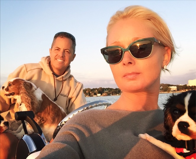 Amanda and Roger Battistoni with their dogs on the water